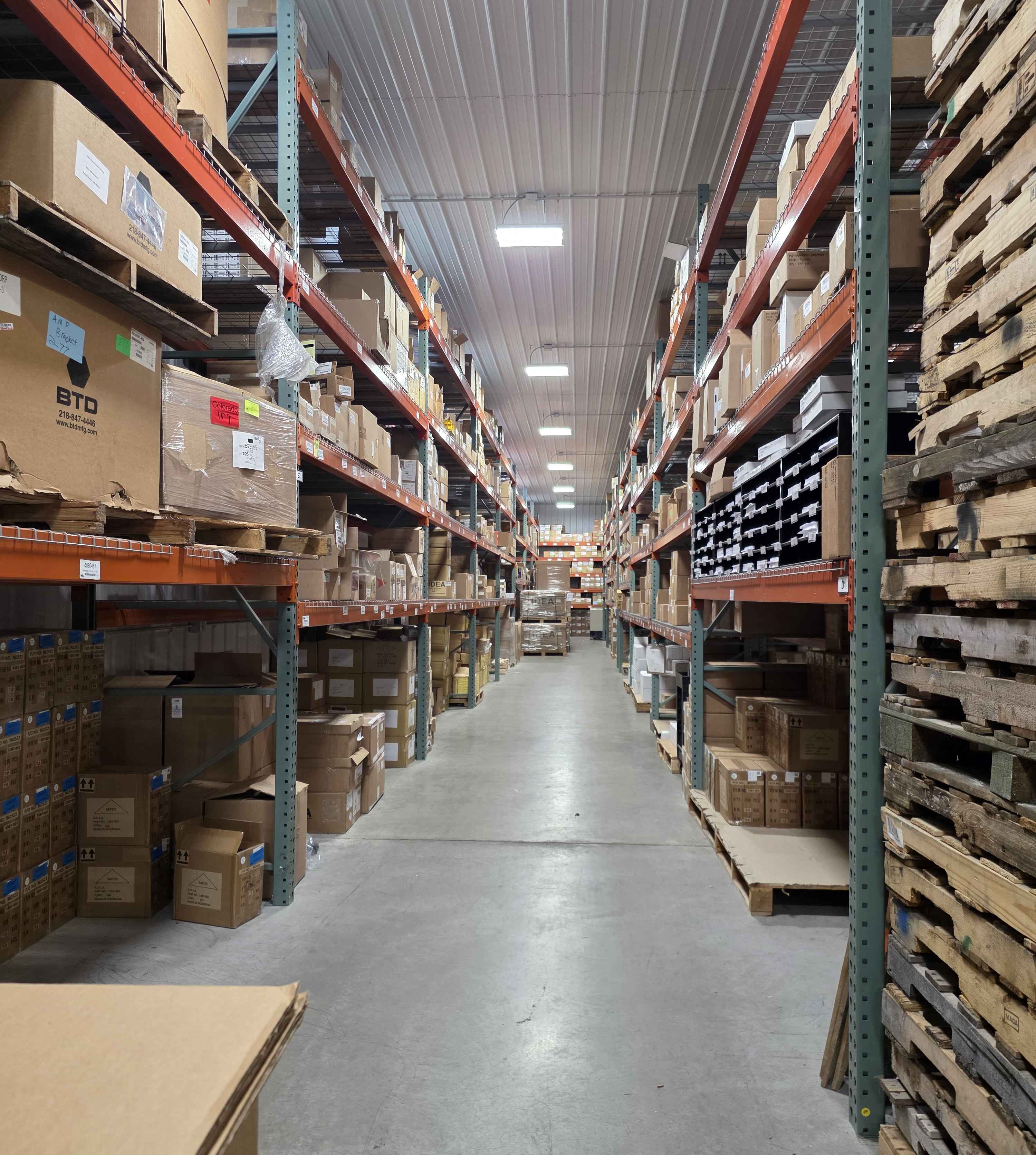 Warehouse aisle with stocked shelving